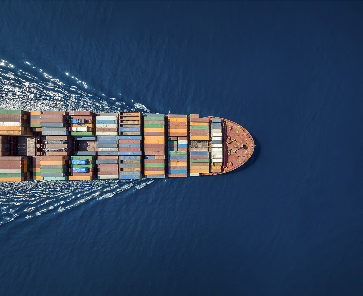 Aerial top down view of a large container cargo ship with copy space